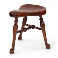 Rare J. Shoolbred Polished Mahogany Saddle Stool