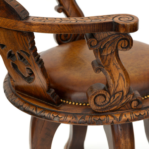Heavily Carved Oak Ship's Chair with Inset Leather Seat